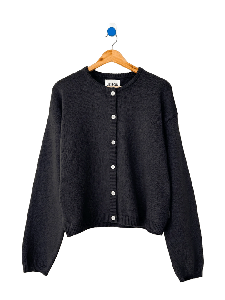 Le Bon Shoppe Laila Cardigan in Black on a wooden hanger | Twentyseven Toronto