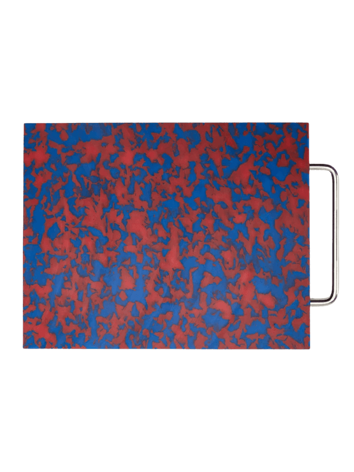 Fredericks and Mae Large Red/Blue Cutting Board showcasing its vibrant, marbled camouflage pattern and sleek silver metal handle | Twentyseven Toronto