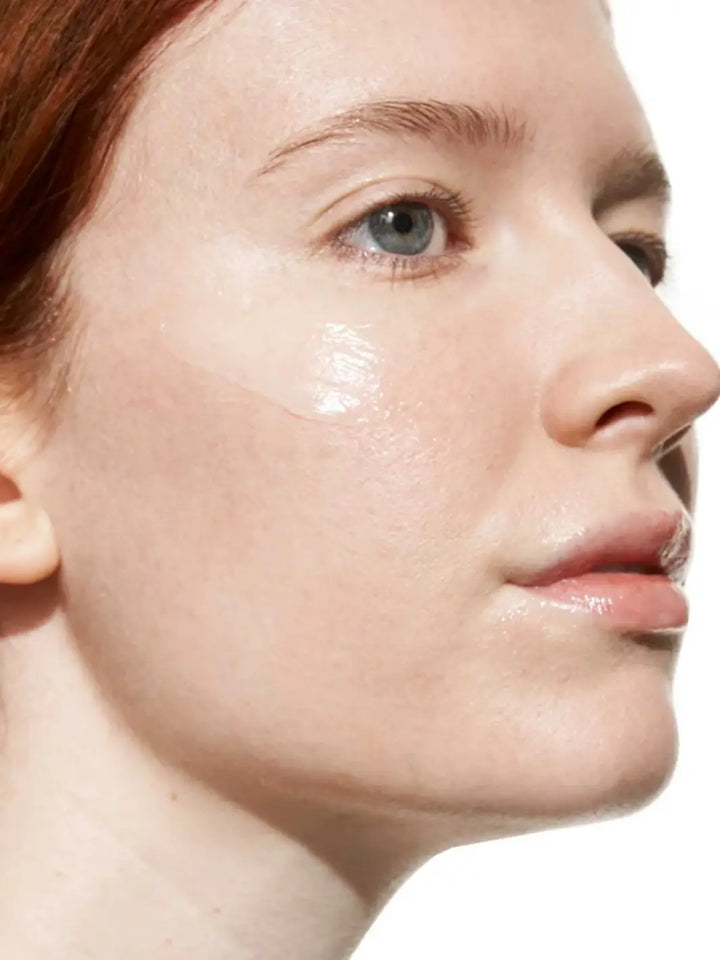 Close-up of a person's face with a focus on Doré Skincare 'Le Baume' swatch | Twentyseven Toronto