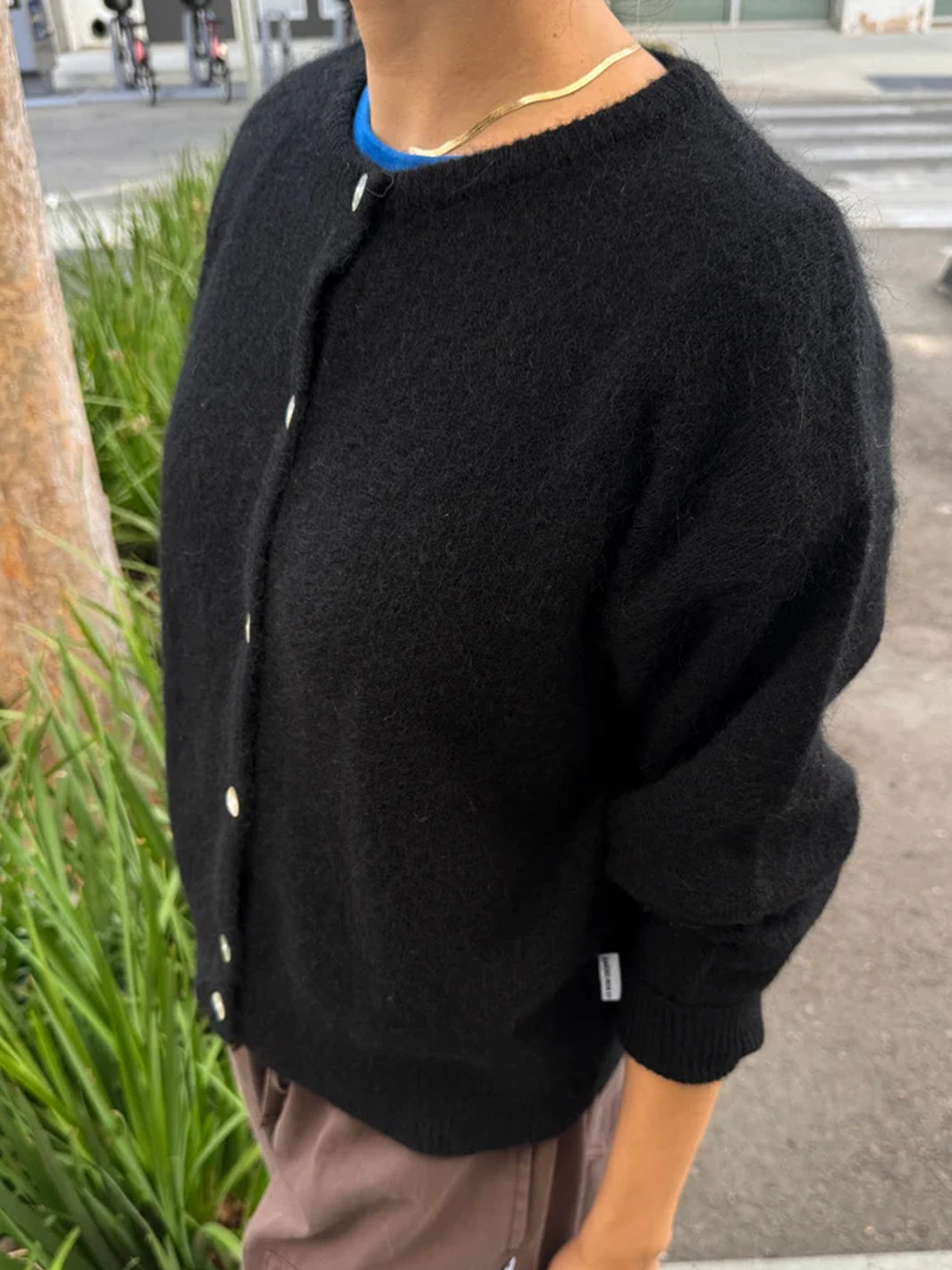 Side view of the Le Bon Shoppe Ayla Mohair Cardigan in Onyx, showing its soft brushed texture and relaxed silhouette | Twentyseven Toronto