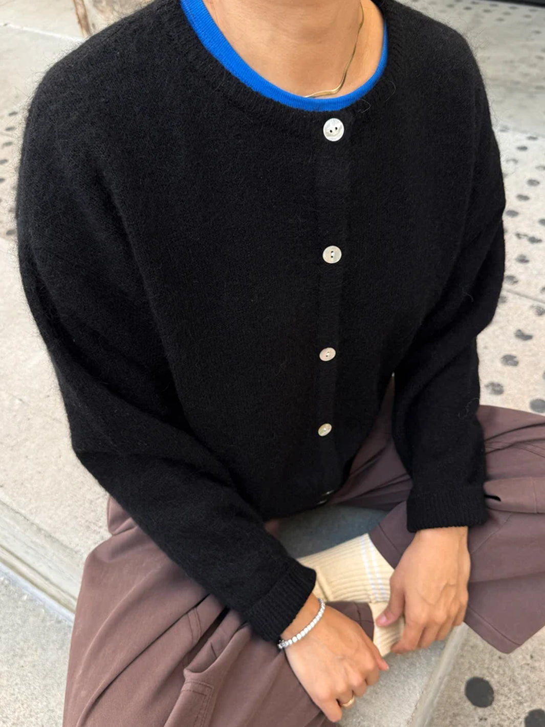 Le Bon Shoppe Ayla Mohair Cardigan in Onyx styled over a blue crew neck top with relaxed trousers | Twentyseven Toronto