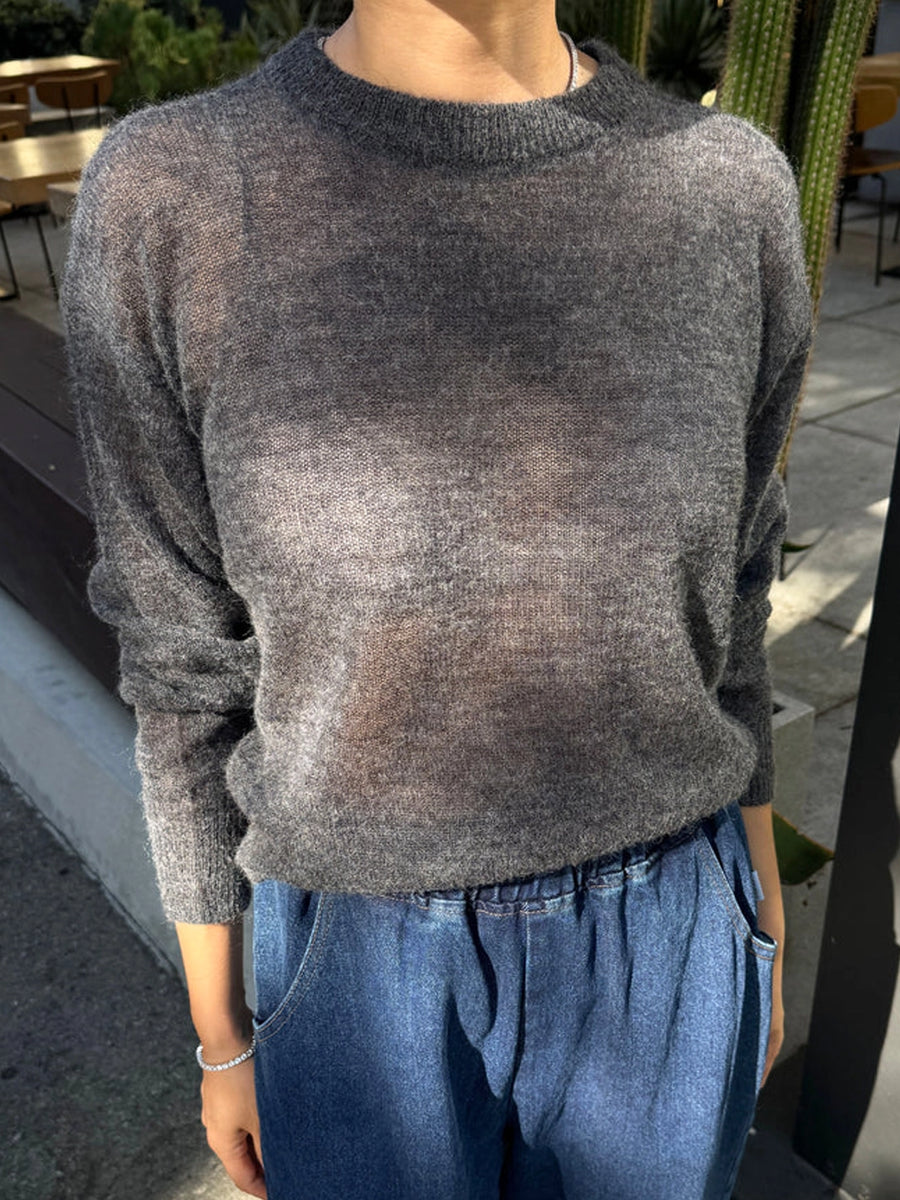 Le Bon Shoppe Cecile Crew Neck Mohair Sweater in Charcoal styled with blue jeans, showing its sheer, lightweight knit and relaxed fit | Twentyseven Toronto