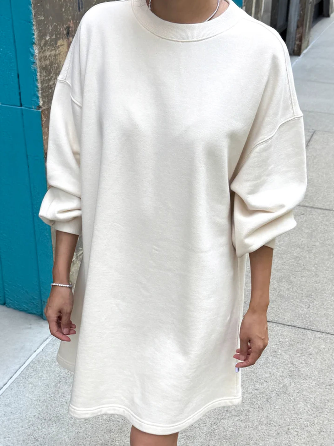 Le Bon Shoppe French Terry Swing Dress in Natural worn with relaxed balloon sleeves, front view  Twentyseven Toronto