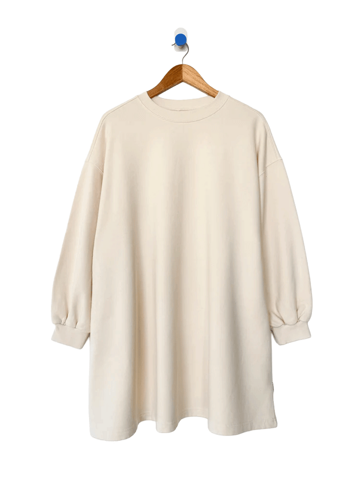 Le Bon Shoppe French Terry Swing Dress in Naturel on wooden hanger, front view | Twentyseven Toronto