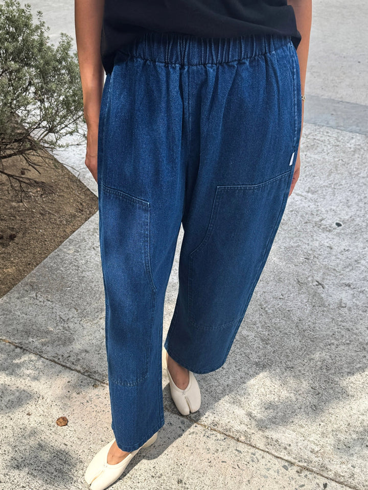 Le Bon Shoppe Gardener’s Pants in Blue Denim showing the relaxed tapered fit, elastic waistband, and carpenter-inspired front patch pockets | Twentyseven Toronto