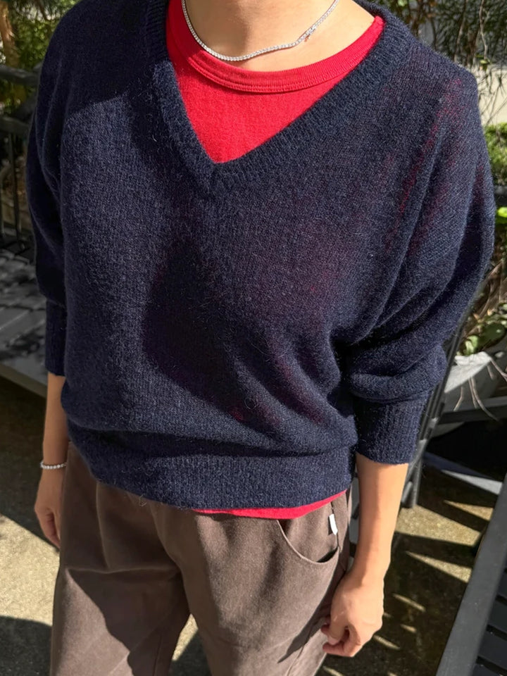 Le Bon Shoppe Matthew V-Neck Mohair Sweater in navy layered over a red crewneck top with brown trousers | Twentyseven Toronto