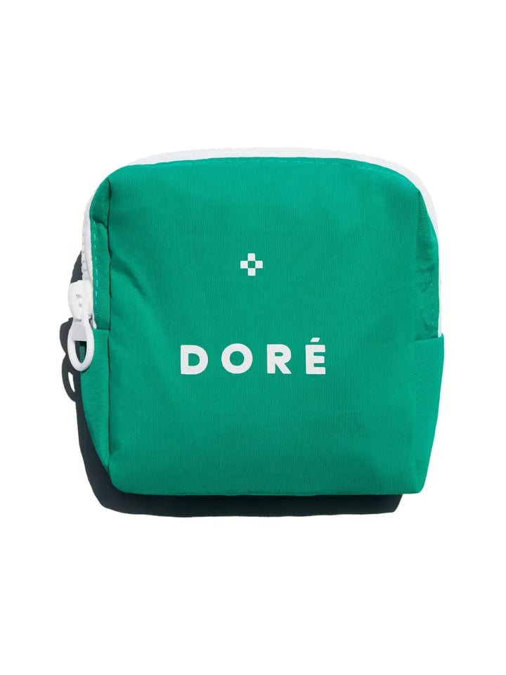 Green pouch for Le Mini Set with 'Doré' branding on a white background | Twentyseven Toronto