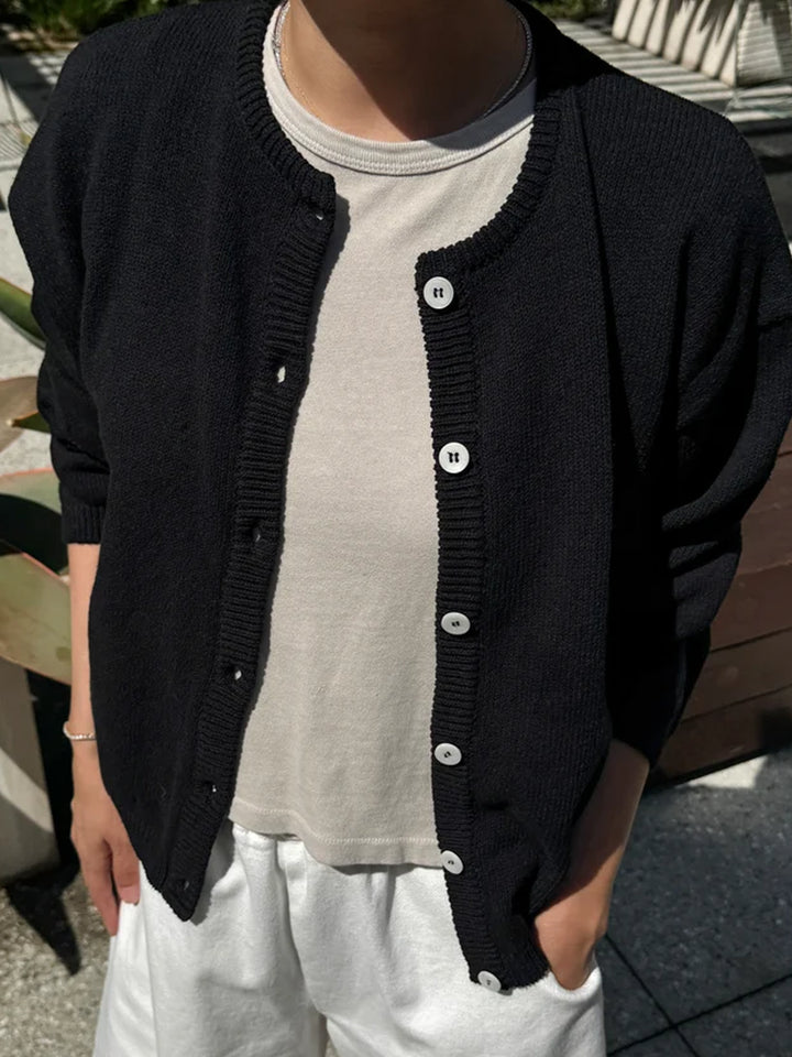 Model wearing the Le Bon Shoppe Laila Cardigan in Black open over a white top | Twentyseven Toronto