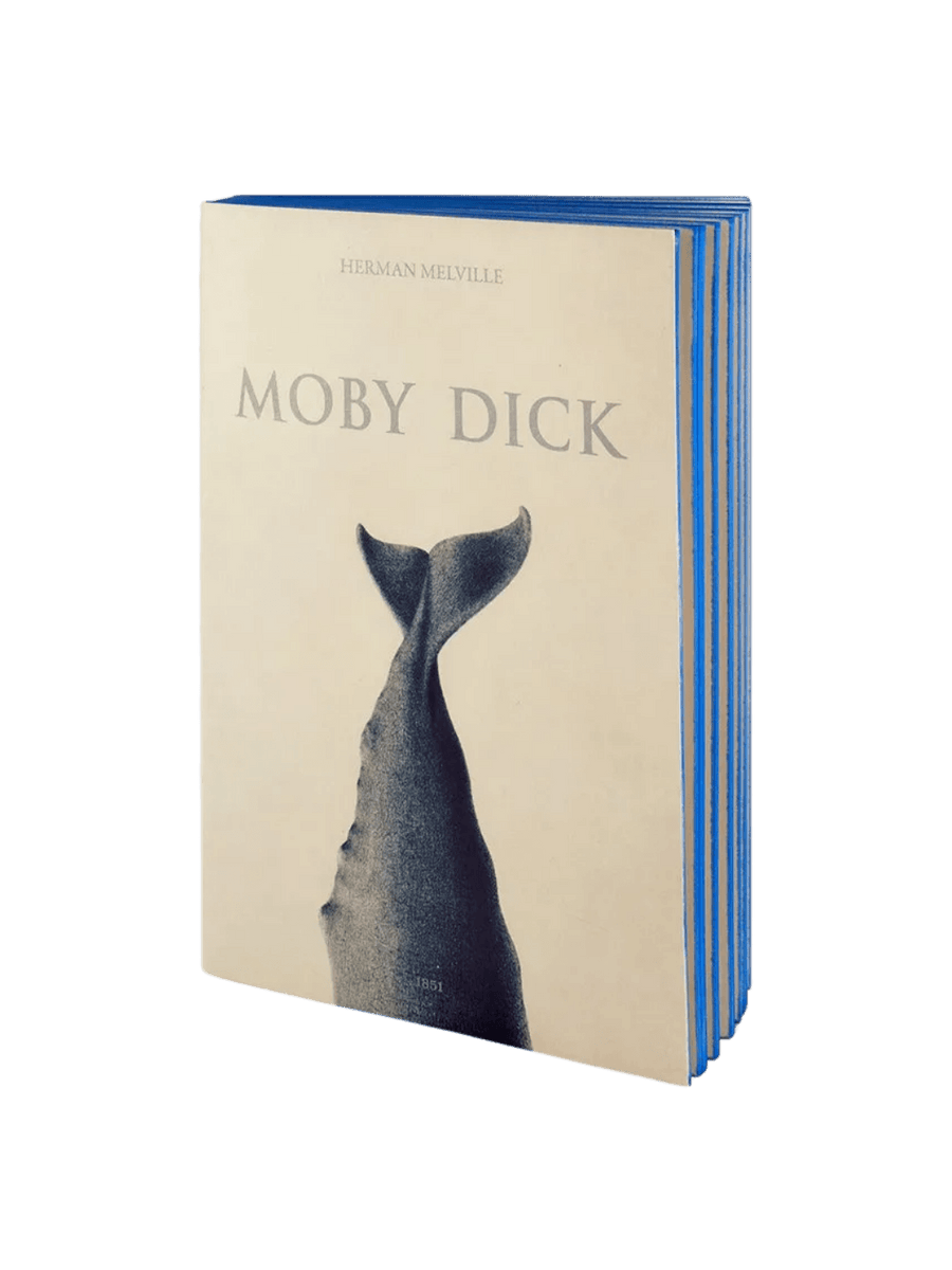 The cream-colored front cover of a Moby Dick inspired notebook from the Slow Design Libri Muti collection features an illustration of a whale's tail and vibrant blue hand-painted page edges | Twentyseven Toronto