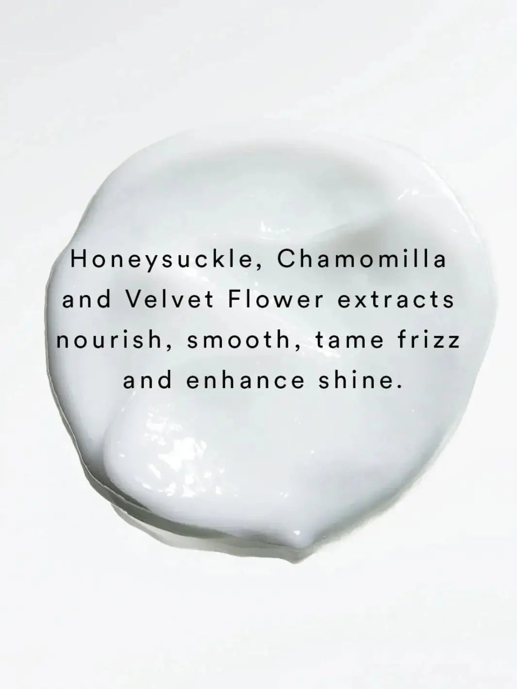 Black text layered over a smooth dollop of white cream lists honeysuckle, chamomilla, and velvet flower extracts as key frizz-taming ingredients in Hair by Sam McKnight Light Nourish Conditioner | Twentyseven Toronto