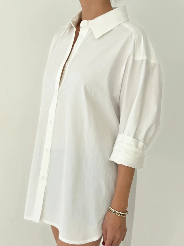 Person wearing a button up 'Light Weight Owen Shirt' in 'White' from Le Bon Shoppe against a neutral background | Twentyseven Toronto