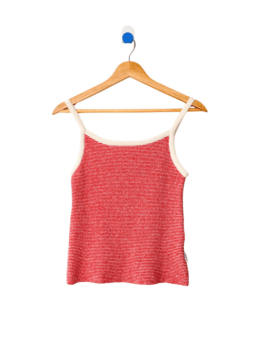 Red 'Lily Sweater Cami' tank top in 'Red Stripe' design with white trim from Le Bon Shoppe on a wooden hanger against a transparent background | Twentyseven Toronto