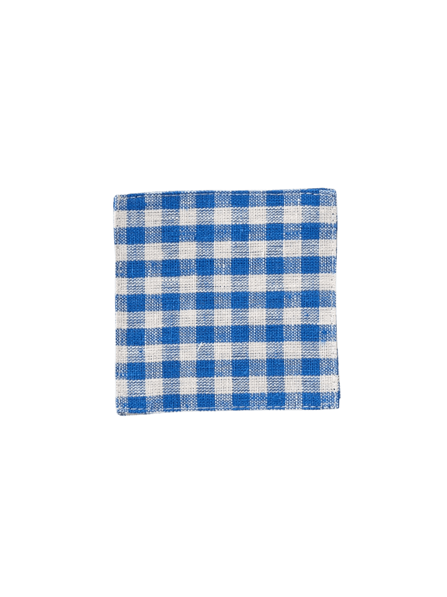 A square Fog Linen Work Linen Coaster - Keily with a blue and white checkered linen weave against a transparent background | Twentyseven Toronto