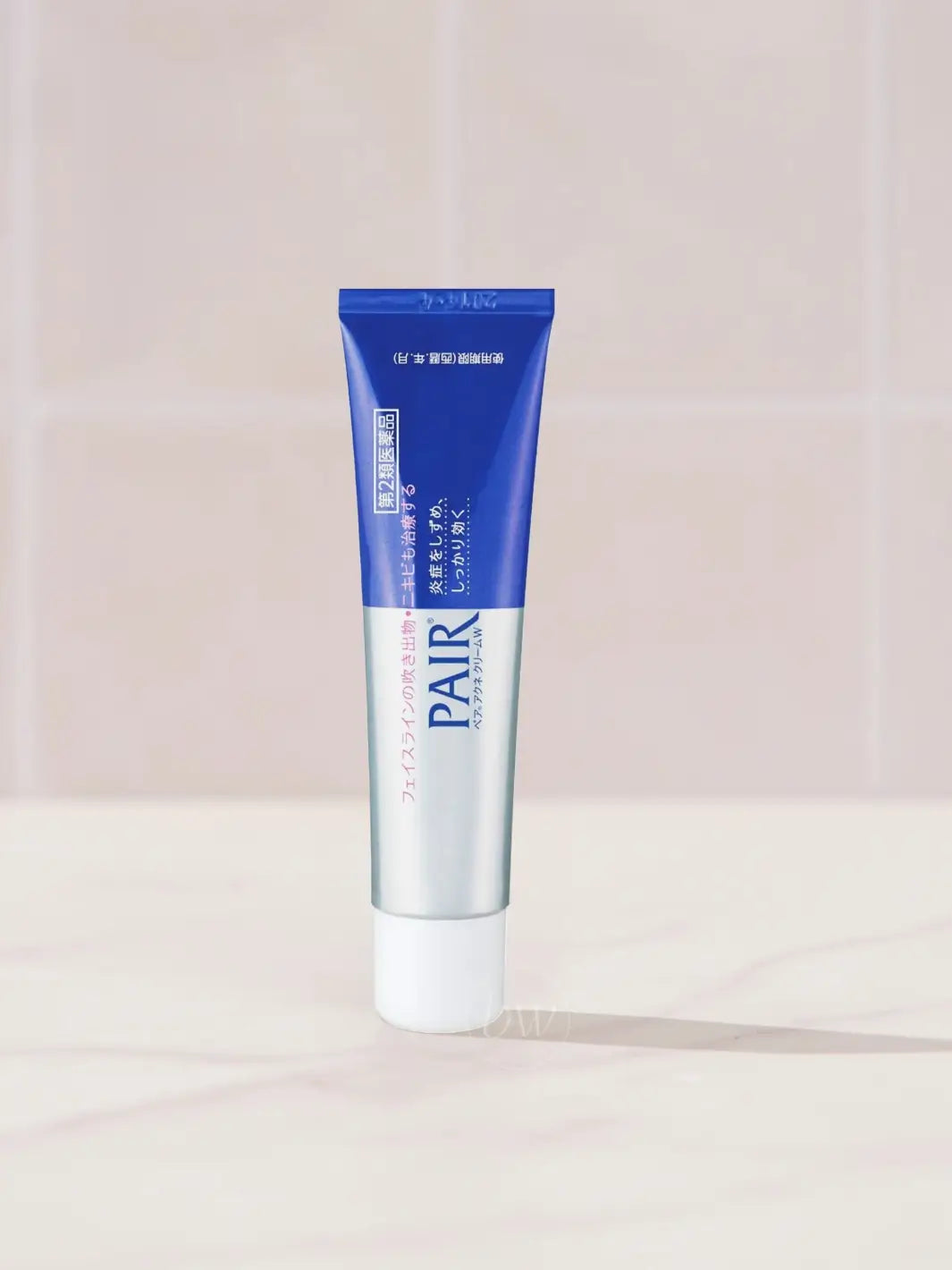 Blue and silver Lion Pair Acne Cream 24g tube on a light background | Twentyseven Toronto