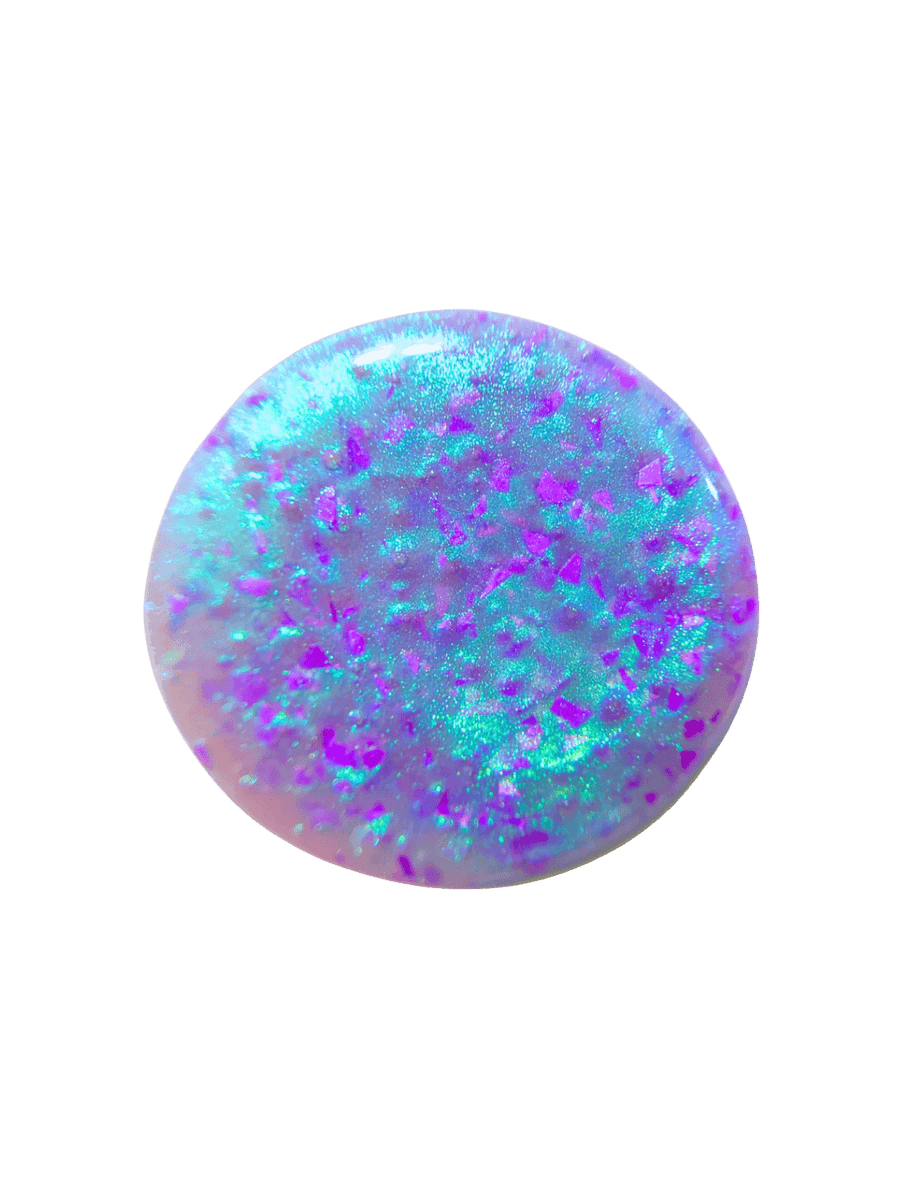 Circular color swatch showing translucent purple base filled with bright teal shimmer and purple flakes from Death Valley Nails Local Birds Erupting Into Hootenanny At The Spit Of Spring Sprinklers Nail Polish | Twentyseven Toronto