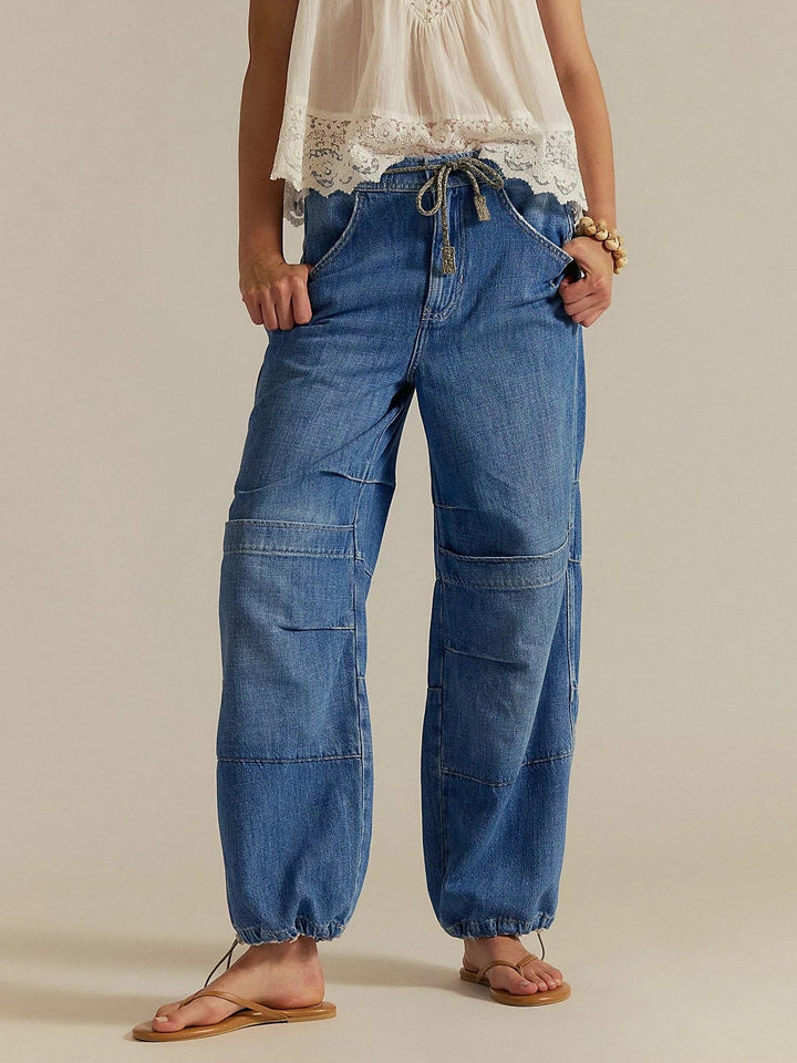 A front view shot highlights the elastic waistband with drawstring and relaxed fit of the Free People Logan Cinched Cargo Jeans - Harper | Twentyseven Toronto