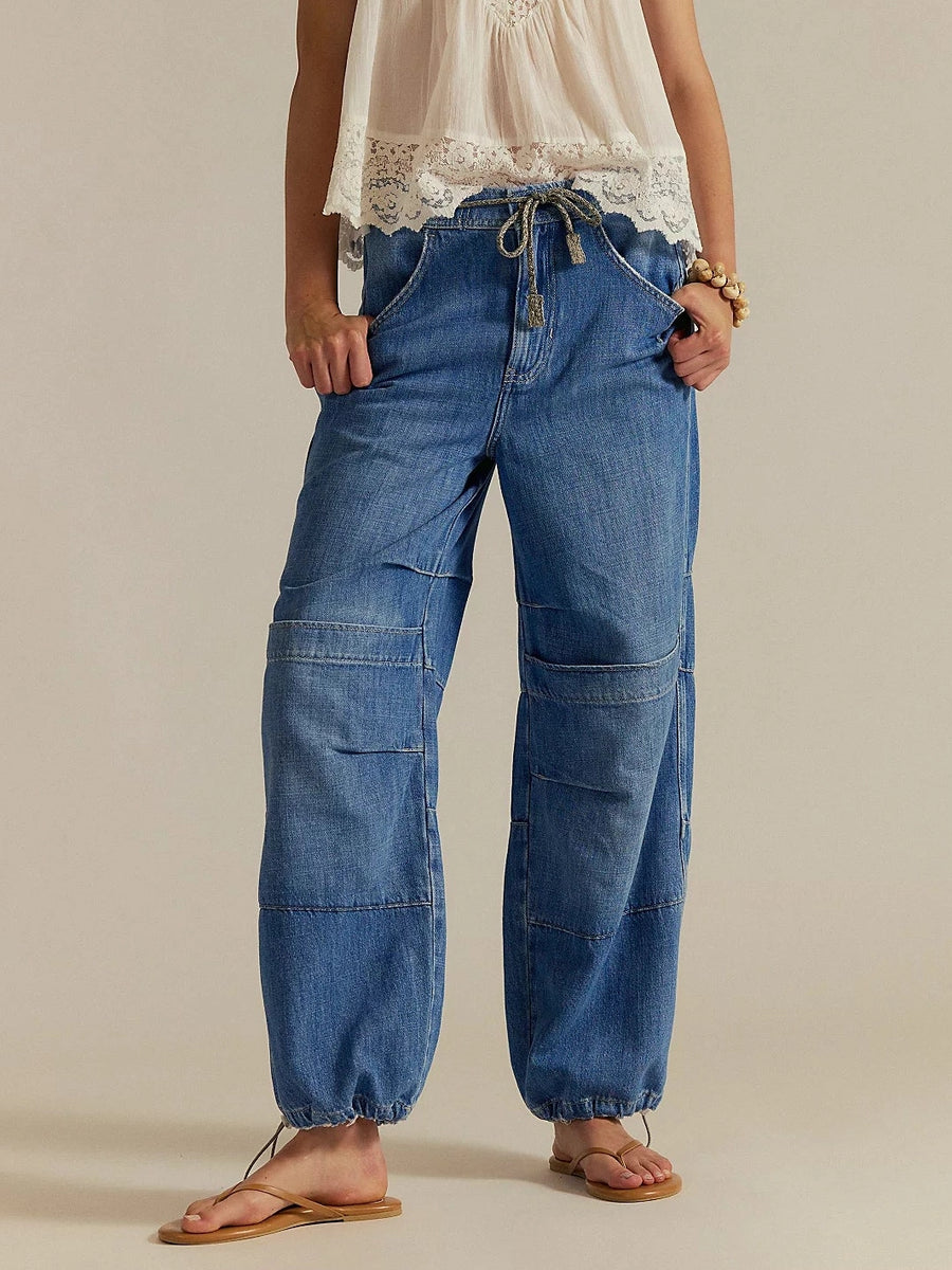 A front view shot highlights the elastic waistband with drawstring and relaxed fit of the Free People Logan Cinched Cargo Jeans - Harper | Twentyseven Toronto