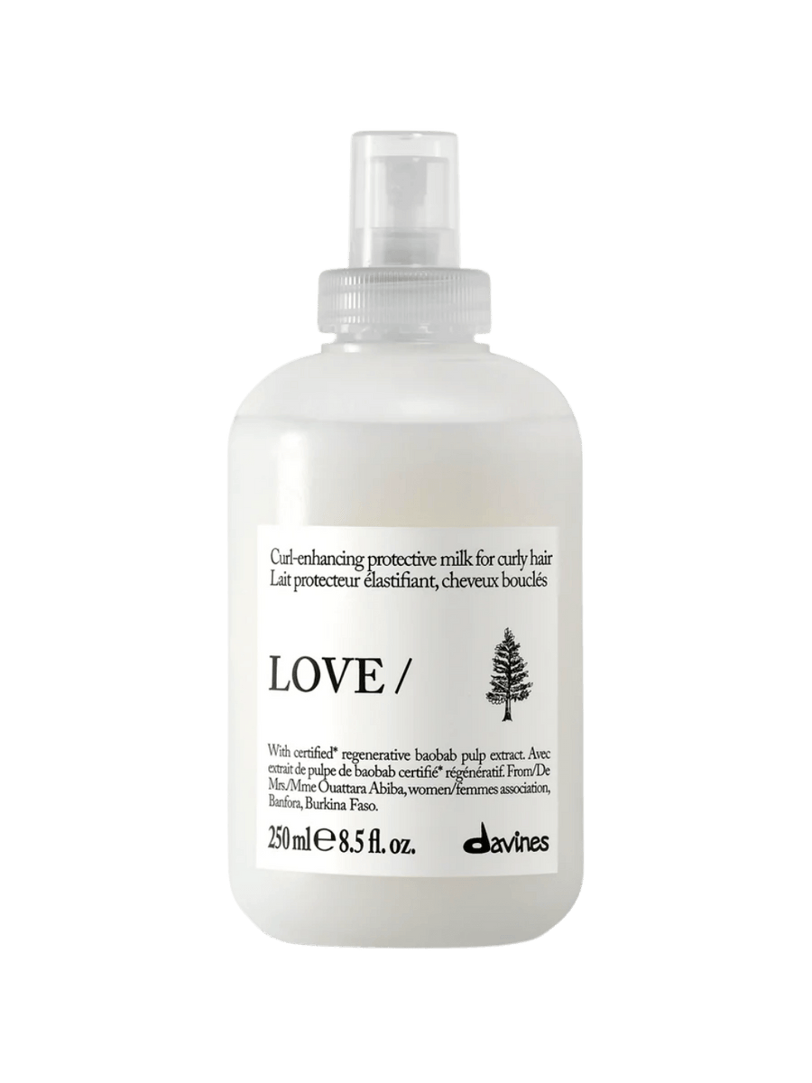 A 250 ml spray bottle of Davines LOVE CURL Enhancing Milk for curly hair | Twentyseven Toronto