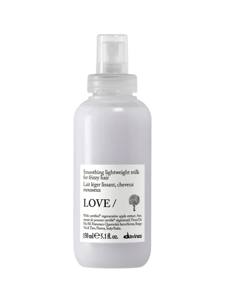 A 150 ml bottle of Davines LOVE SMOOTHING Lightweight Milk for frizzy hair | Twentyseven Toronto