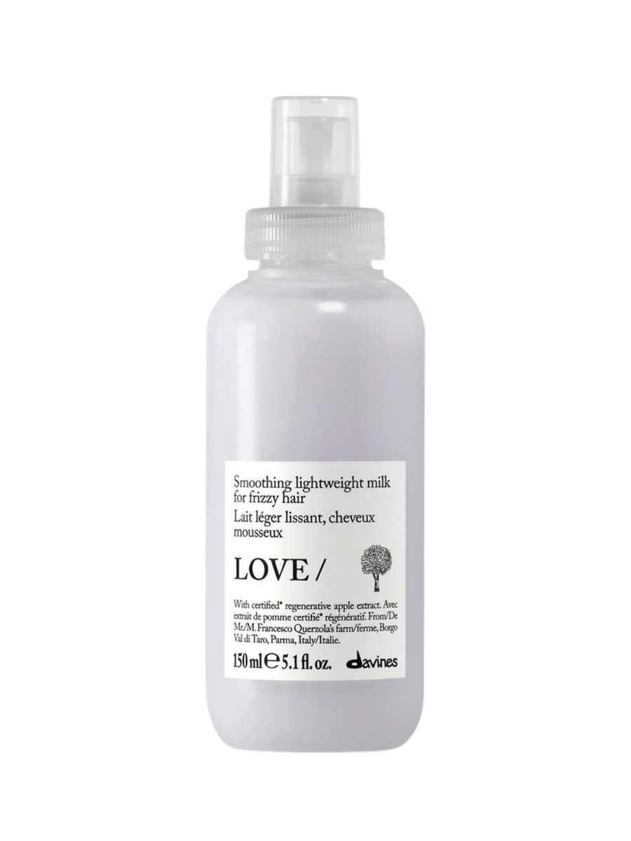 A 150 ml bottle of Davines LOVE SMOOTHING Lightweight Milk for frizzy hair | Twentyseven Toronto