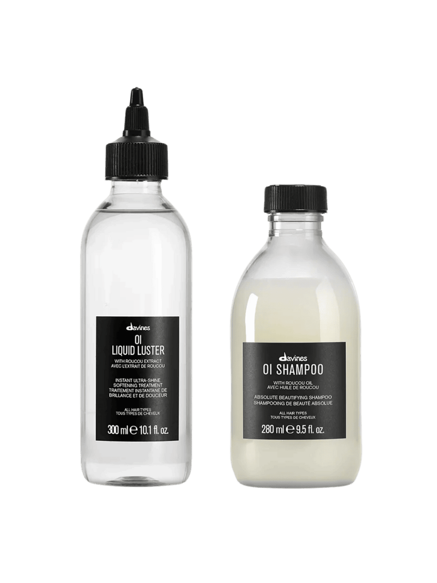 Two Davines hair care products, 'OI Liquid Luster' (300ml) and 'OI Shampoo' (280ml), on a transparent background | Twentyseven Toronto