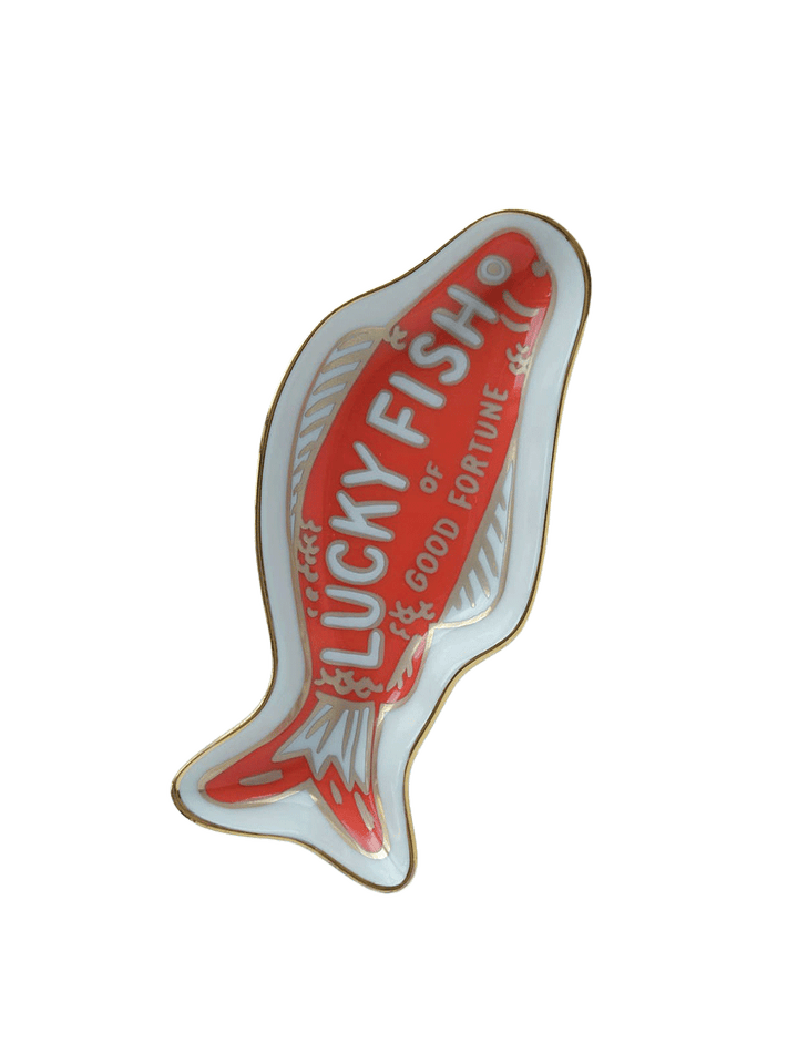 Idlewild Co. Fortune Fish porcelain trinket dish featuring a red lucky fish design with white detailing and gold trim on a white background | Twentyseven Toronto