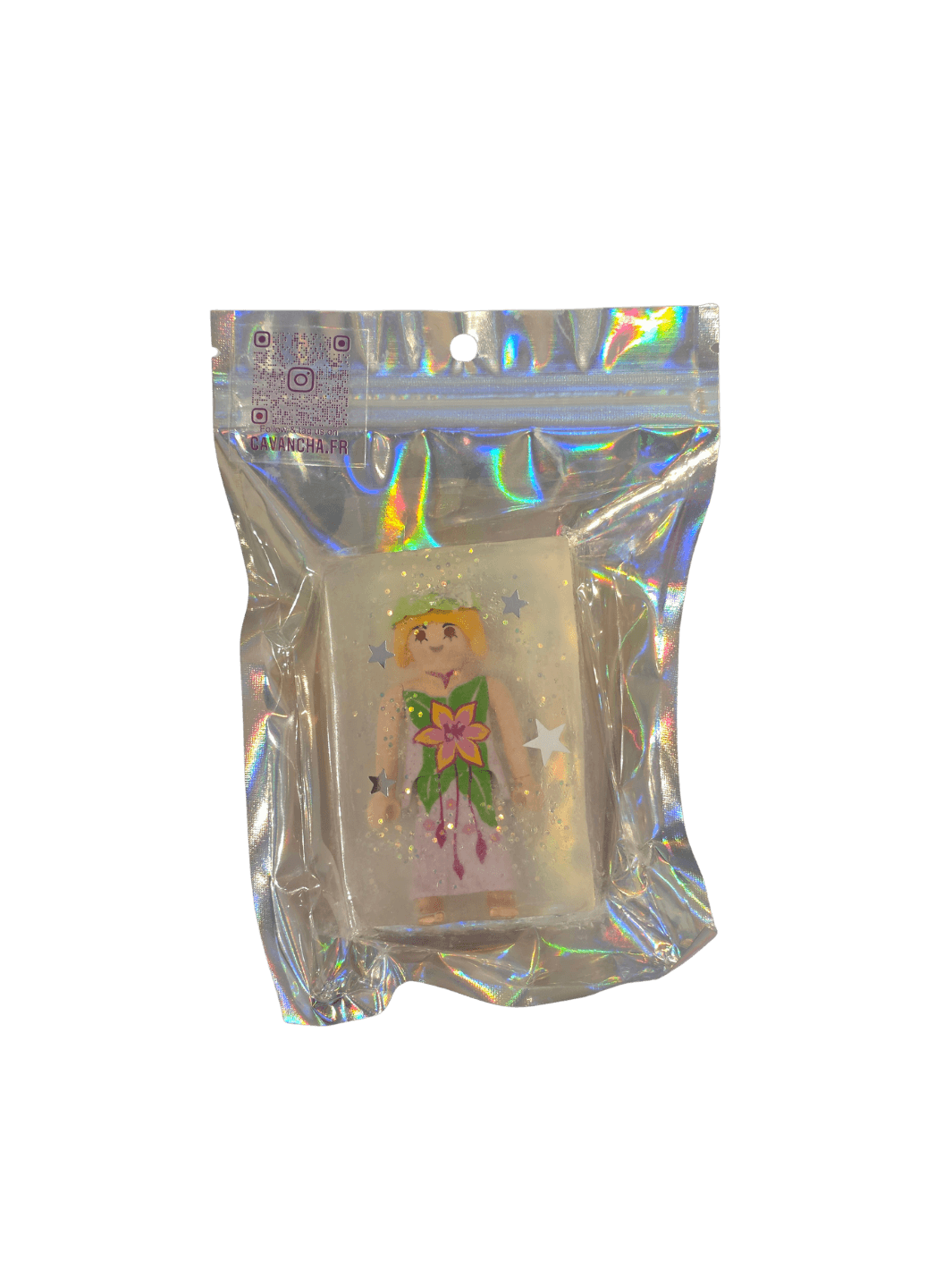 A clear bar of Cavancha Magic Glitter Soap Adults - Playmo, containing a small Playmobil-style woman figurine in a floral dress and embedded star glitter, packaged inside a shiny holographic pouch | Twentyseven Toronto