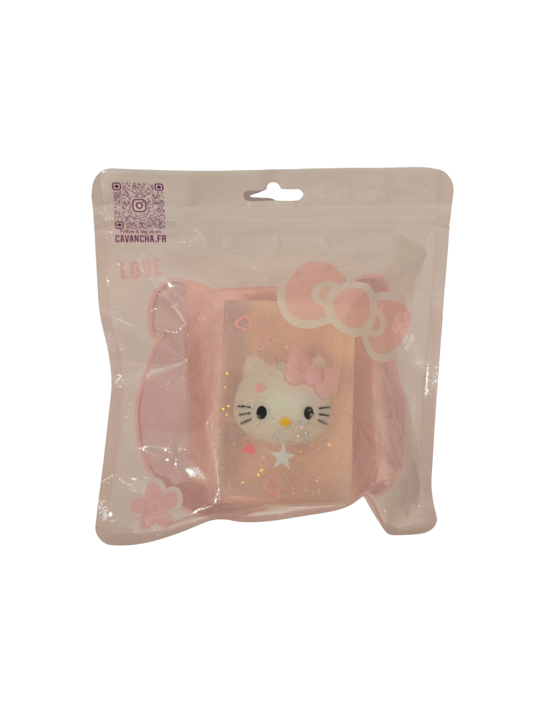 A clear bar of Cavancha Magic Glitter Soap - Hello Kitty, featuring an embedded Hello Kitty face charm, star glitter, and small pink hearts, packaged inside a pink ziplock pouch | Twentyseven Toronto