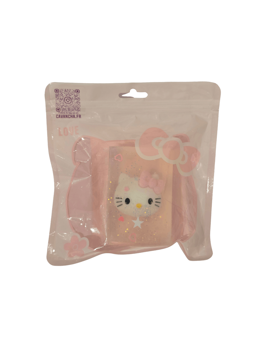 A clear bar of Cavancha Magic Glitter Soap - Hello Kitty, featuring an embedded Hello Kitty face charm, star glitter, and small pink hearts, packaged inside a pink ziplock pouch | Twentyseven Toronto