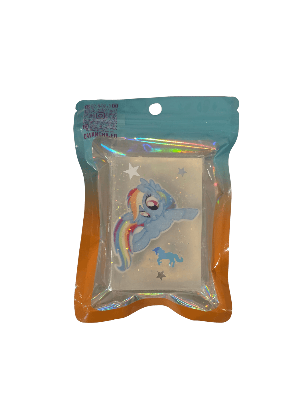 A clear bar of Cavancha Magic Glitter Soap - My Little Pony, embedded with a small blue pony character charm with a rainbow mane, star glitter, and a tiny blue unicorn silhouette, packaged inside a blue and orange gradient pouch | Twentyseven Toronto