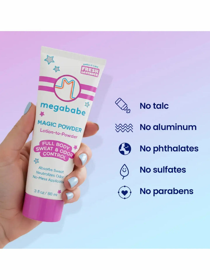 Hand holding a Megababe Magic Powder tube against a light purple background with product benefits listed | Twentyseven Toronto