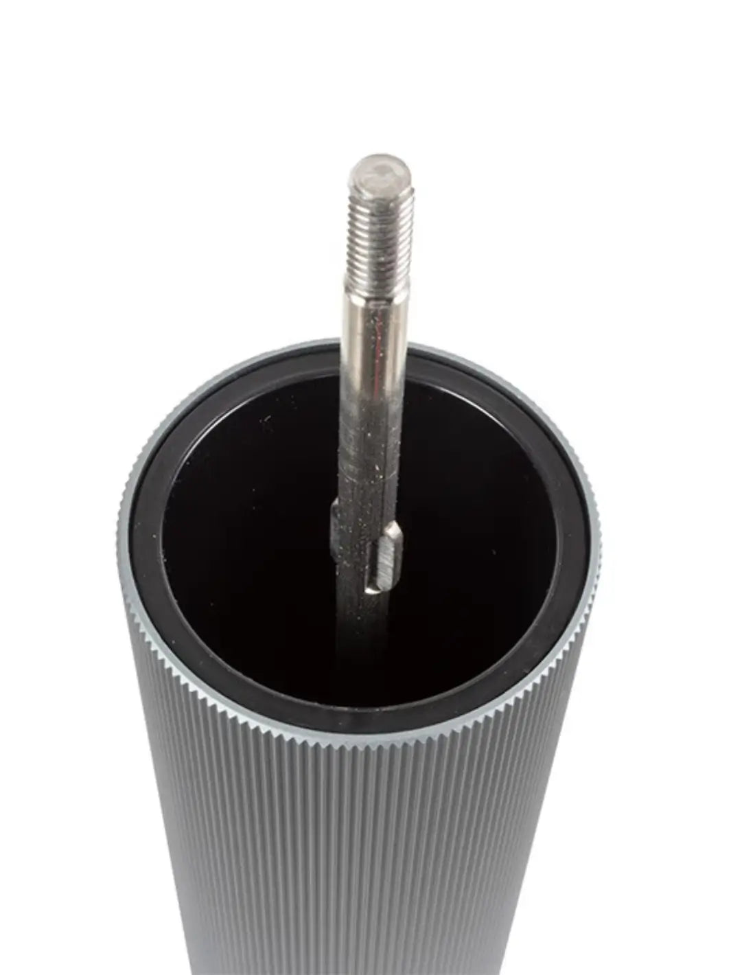 Metallic cylindrical object with a rod inside for Peugeot on a white background | Twentyseven Toronto