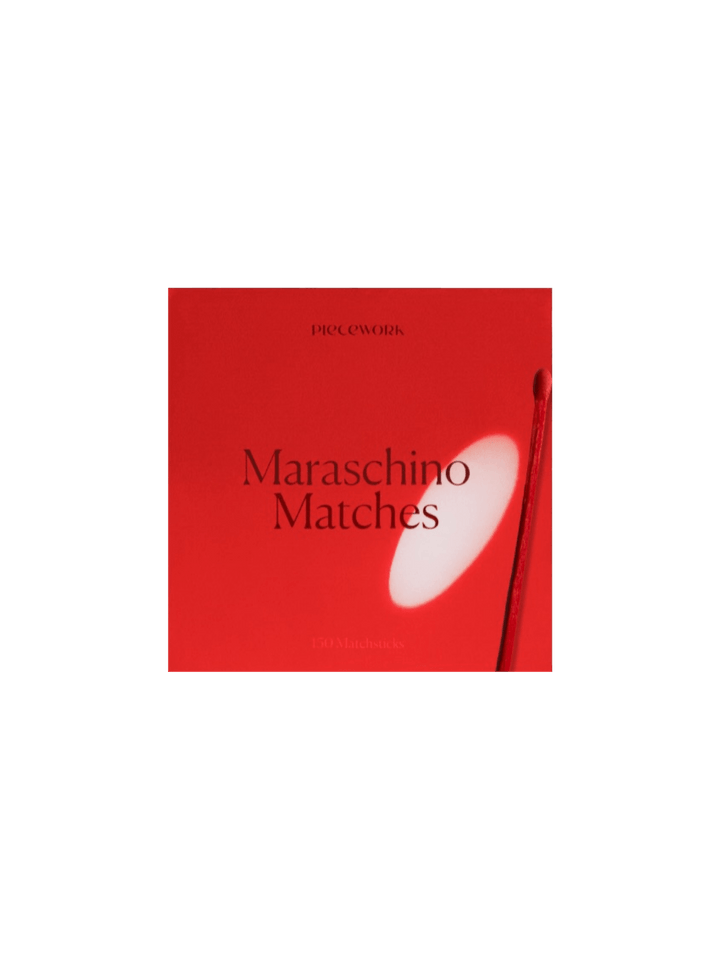 Red box labeled 'Maraschino Matches' from Piecework Puzzles on a transparent background | Twentyseven Toronto