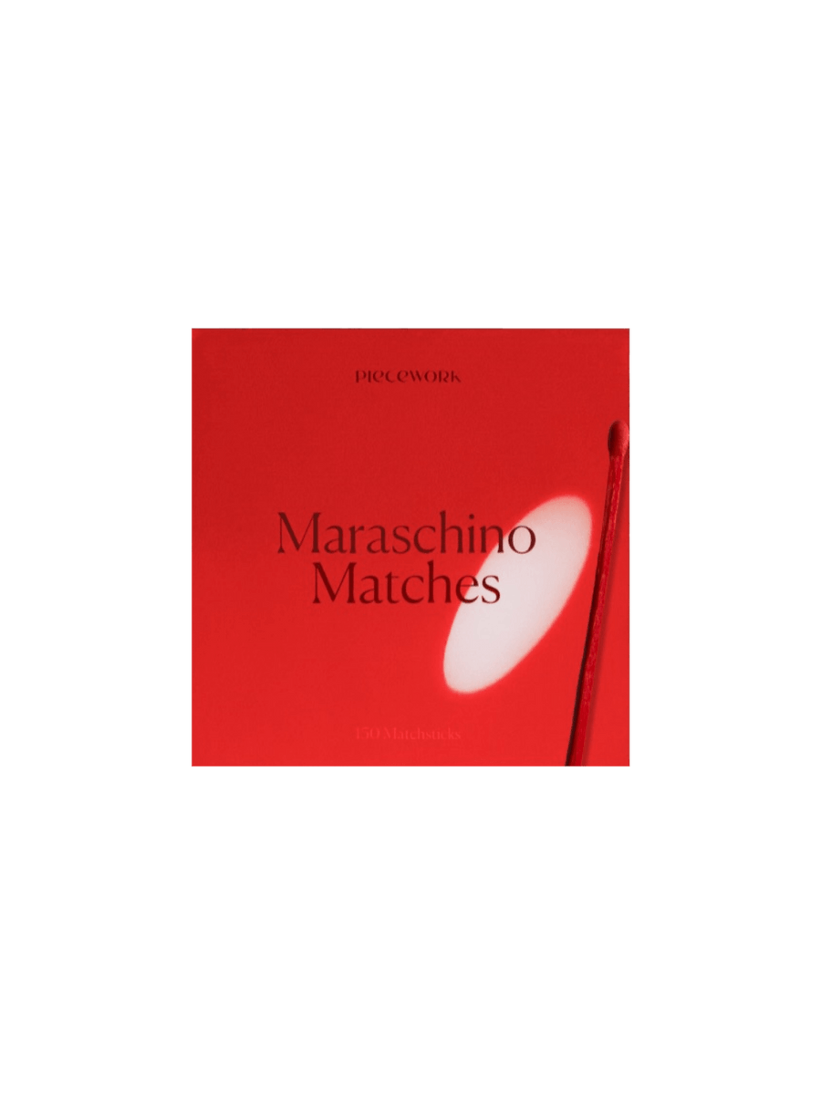 Red box labeled 'Maraschino Matches' from Piecework Puzzles on a transparent background | Twentyseven Toronto