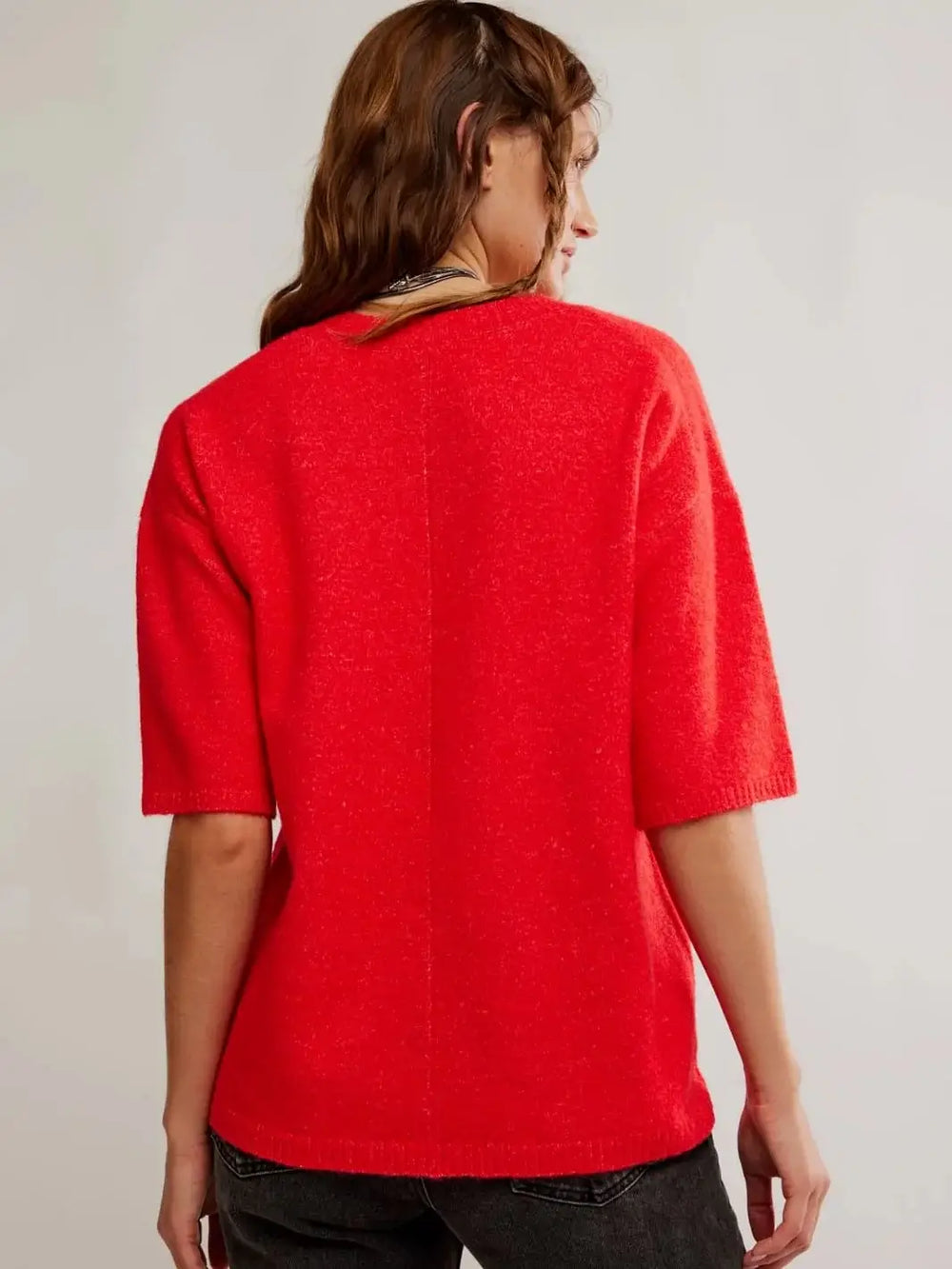 A direct rear view captures the clean hang, relaxed drape, and ribbed hemline of the Free People Margot SoftSpun Sweater Tee in Cherry Pop Melange | Twentyseven Toronto