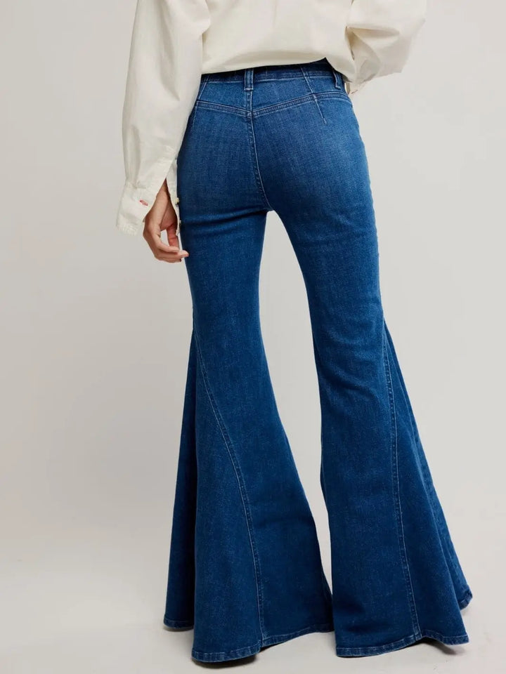 A view from the back highlights the contoured fit and structured rear yoke stitching of the Free People Marque Flare Jeans - Kora | Twentyseven Toronto