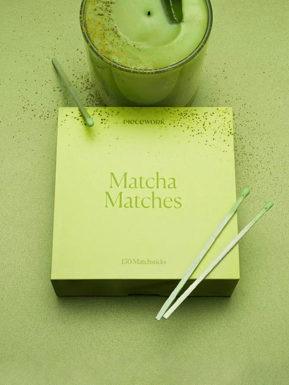 Light green box labeled 'Matcha Matches" below a green candle on a light green background | Twentyseven Toronto