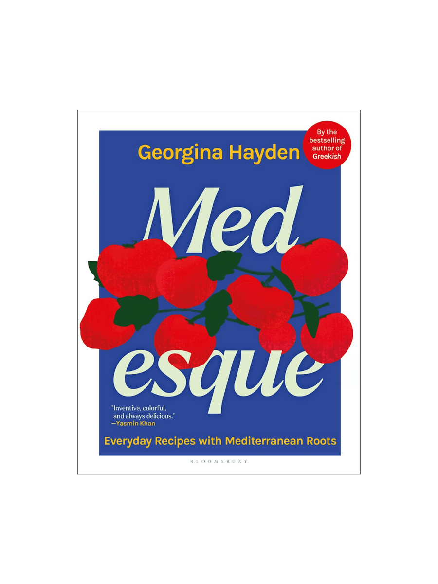 Front cover of the cookbook MEDesque: Everyday Recipes with Mediterranean Roots by Georgina Hayden, featuring a bold blue background with an illustration of bright red tomatoes on a vine | Twentyseven Toronto