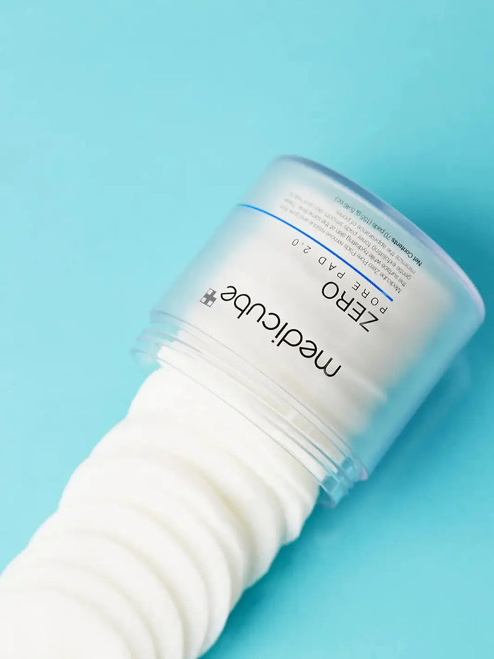 Container of Medicube Zero Pore Pads on a blue background | Twentyseven Toronto