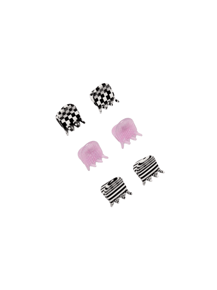 Six tiny hair clips from the CHUNKS Micro Claws in Geo set, featuring checkerboard, striped, and purple designs, are arranged in pairs | Twentyseven Toronto