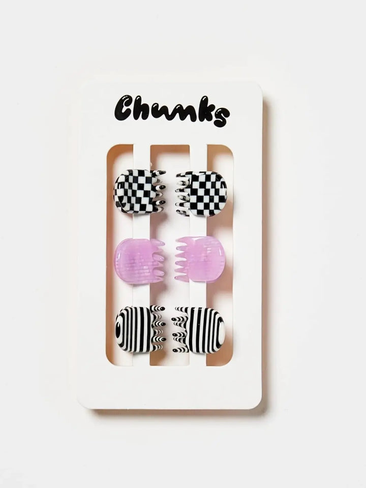 A set of six CHUNKS Micro Claws in Geo, featuring checkered, translucent lilac, and striped patterns, is displayed in pairs on a white cardboard backing | Twentyseven Toronto