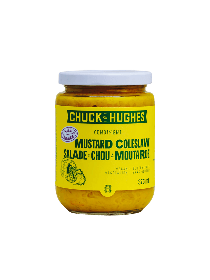 A 375 mL glass jar with a white lid filled with yellow condiment features a bright yellow label reading "Chuck & Hughes Mild Mustard Coleslaw" | Twentyseven Toronto