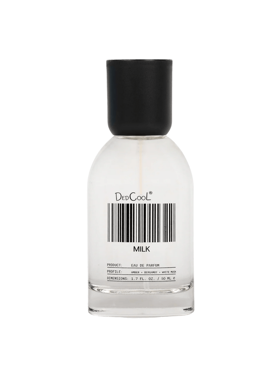 A full size 50ml Dedcool Milk Layering + Enhancer Fragrance bottle featuring its signature barcode label and a black cap | Twentyseven Toronto