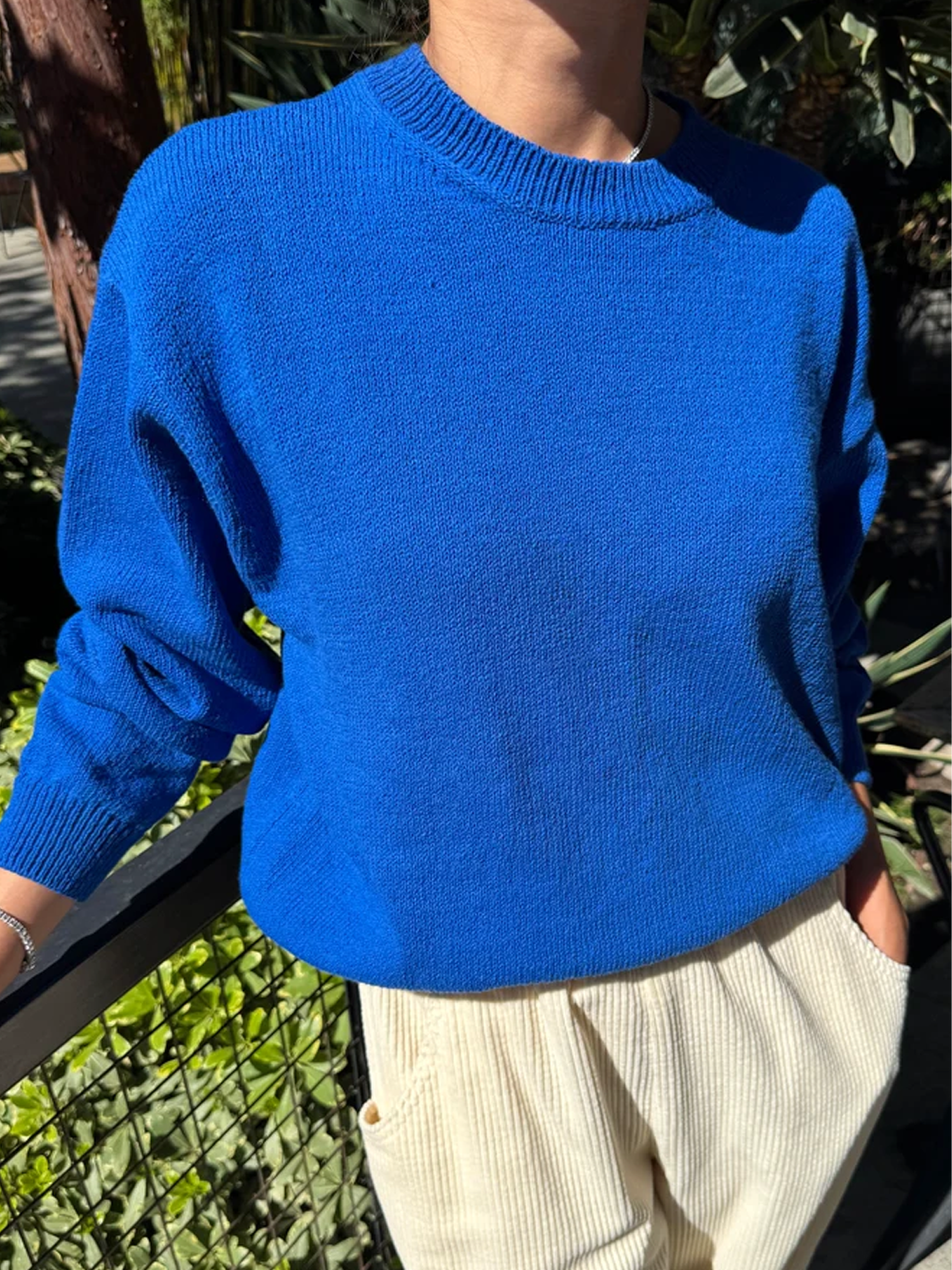 Model wearing the Le Bon Shoppe Milo Cotton Sweater in Cobalt Blue with cream pants | Twentyseven Toronto