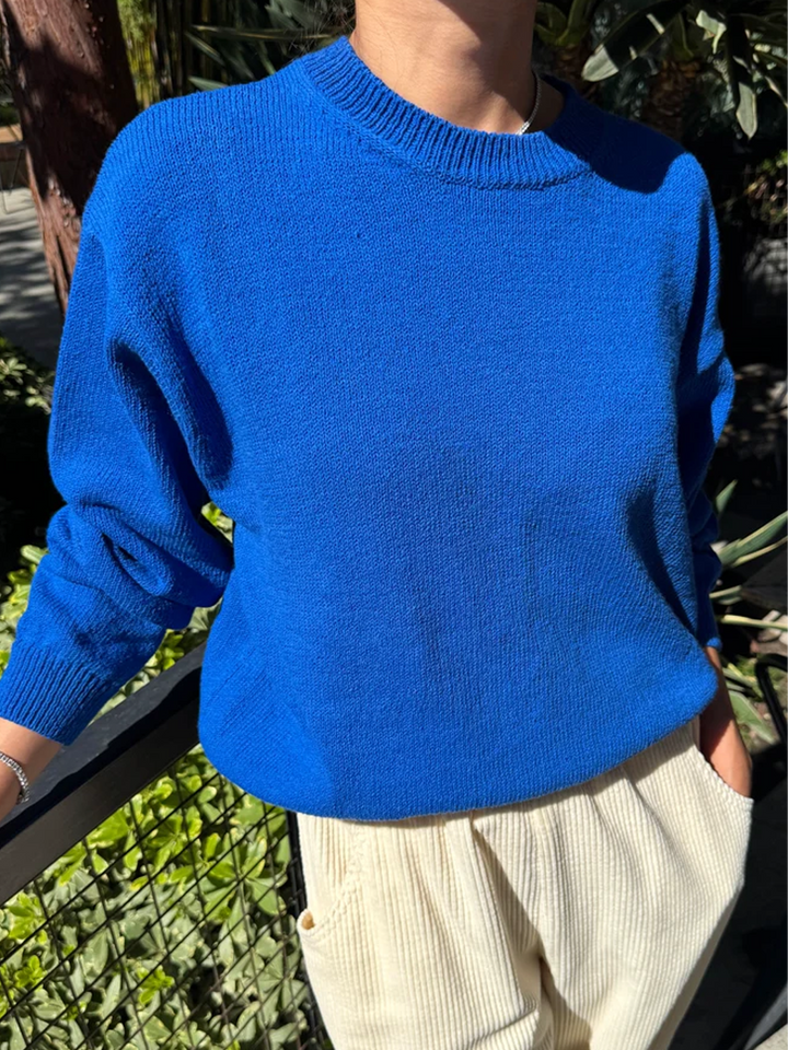 Model wearing the Le Bon Shoppe Milo Cotton Sweater in Cobalt Blue with cream pants | Twentyseven Toronto