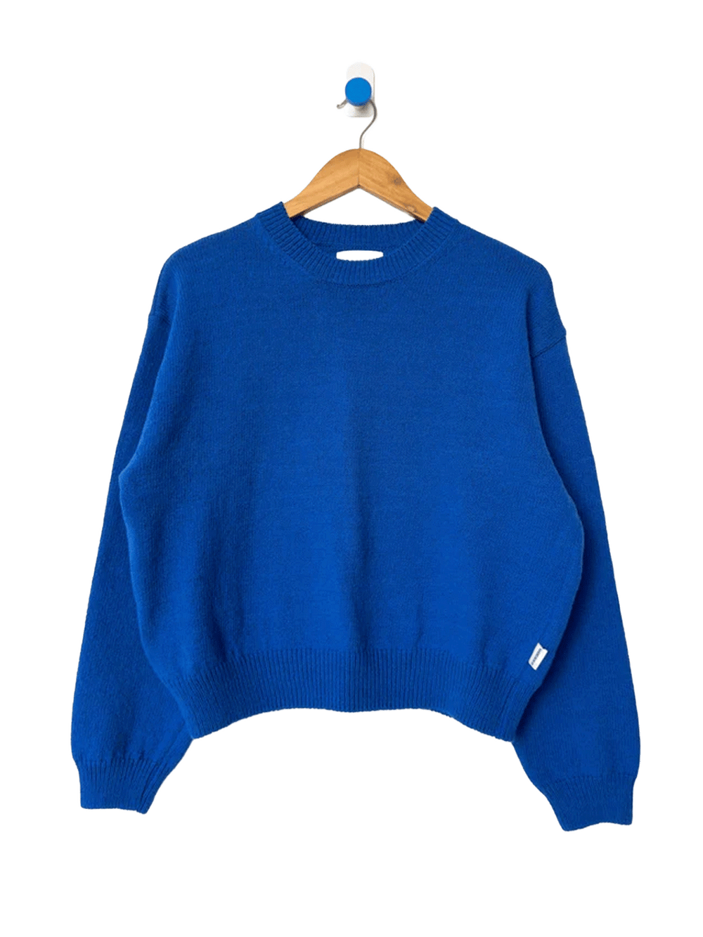 Le Bon Shoppe Milo Cotton Sweater in Cobalt Blue on a wooden hanger | Twentyseven Toronto
