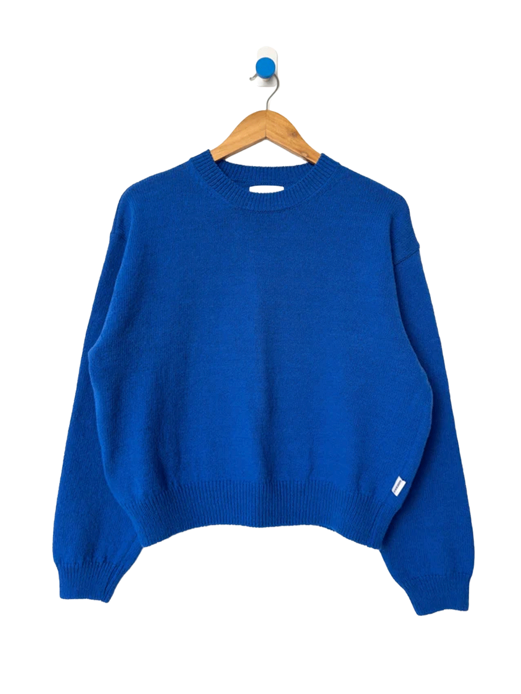 Le Bon Shoppe Milo Cotton Sweater in Cobalt Blue on a wooden hanger | Twentyseven Toronto