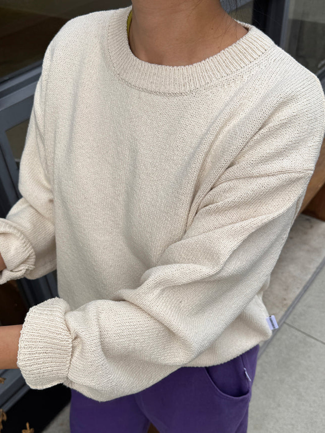 Close-up of the Le Bon Shoppe Milo Cotton Sweater in Natural showing the relaxed fit and lightweight knit | Twentyseven Toronto