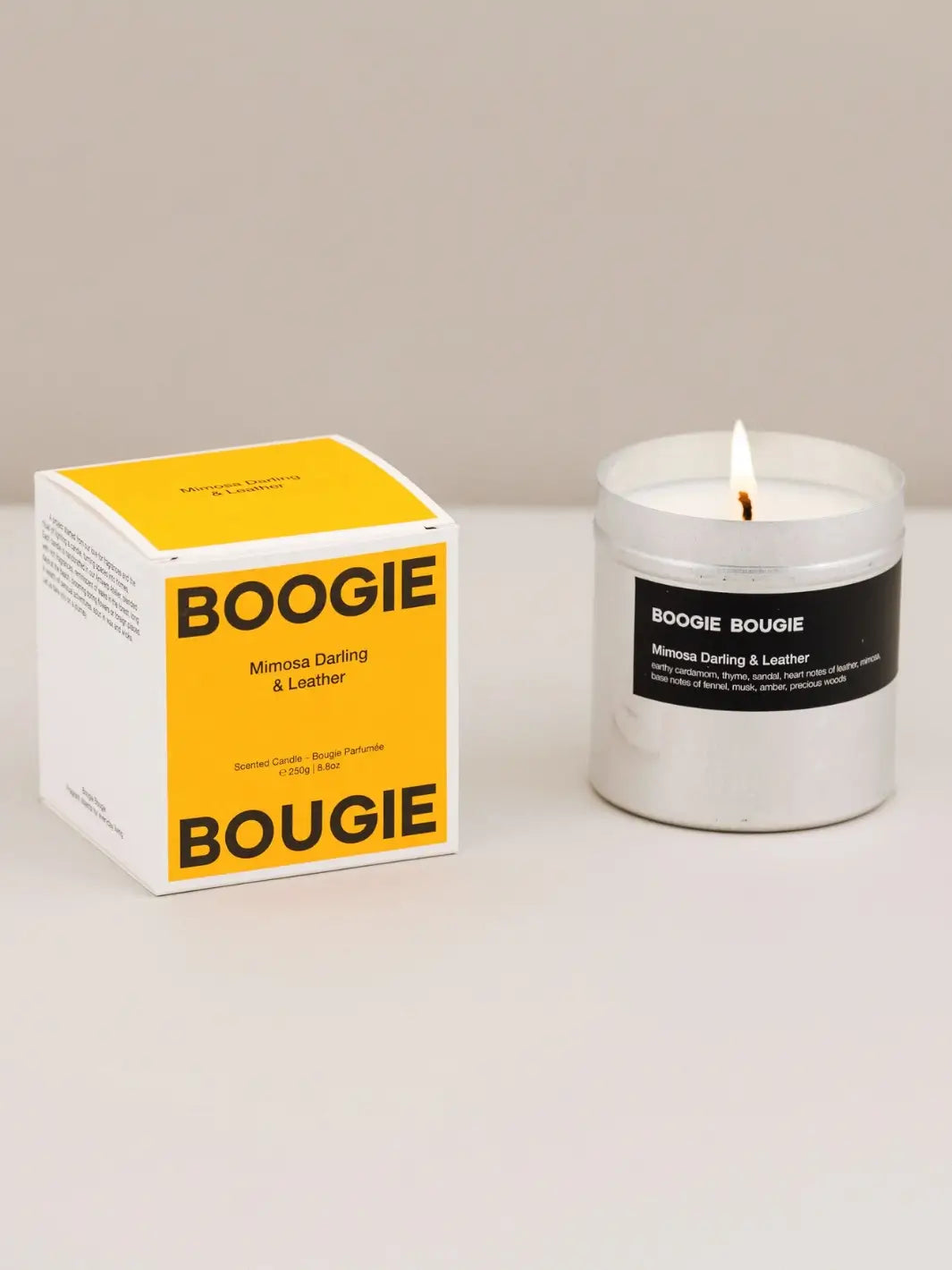 Boogie Bougie Mimosa and Darling Leather candle and yellow packaging on a white background | Twentyseven Toronto