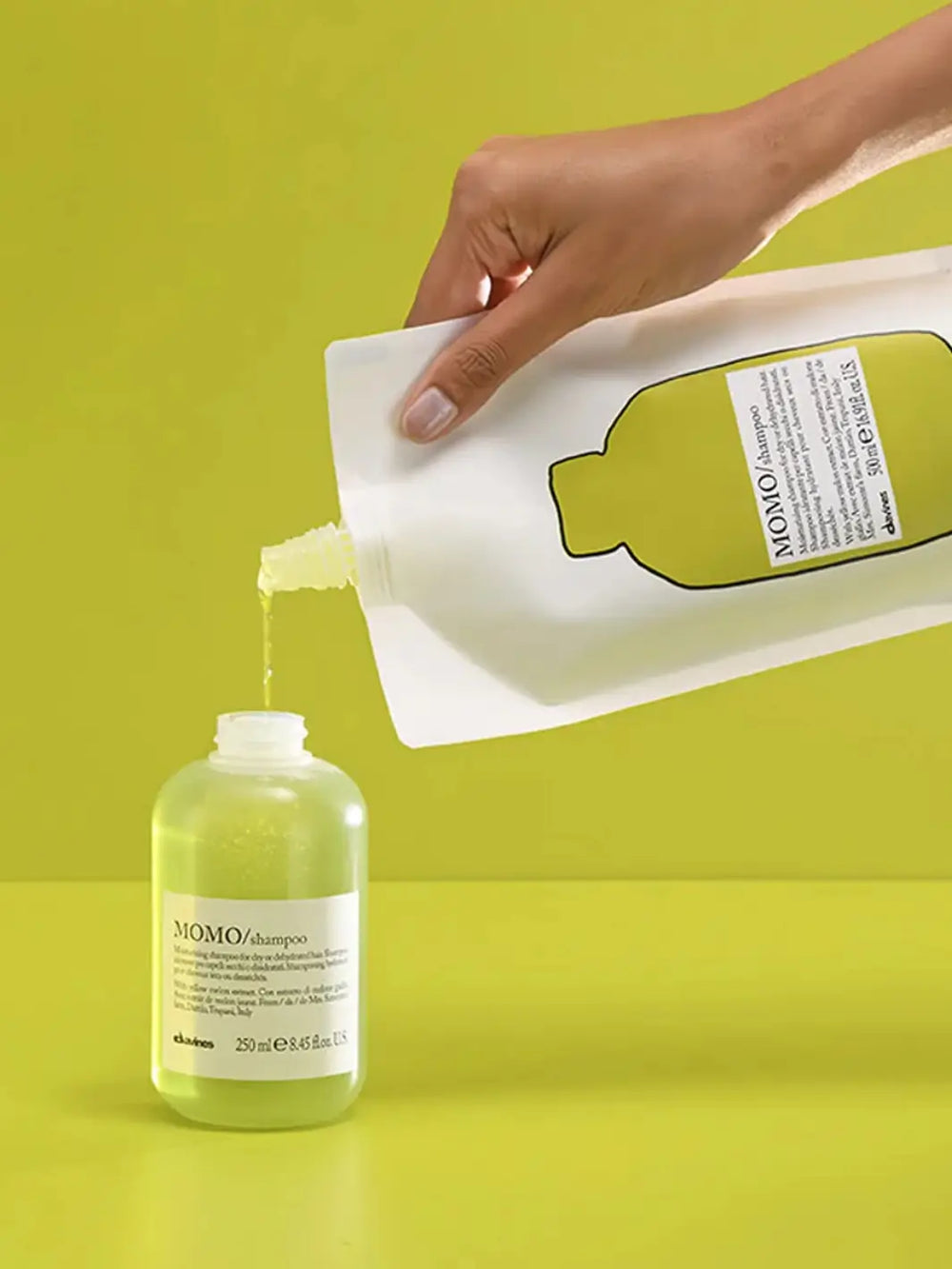 A bottle of MOMO Shampoo (250ml) and MOMO Shampoo Refill Pouch (500ml) on a transparent background | Twentyseven Toronto